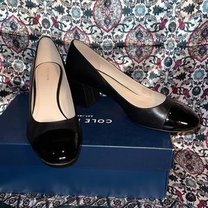 Cole Haan Black Leather pumps with patent front. Great for the office. In box!